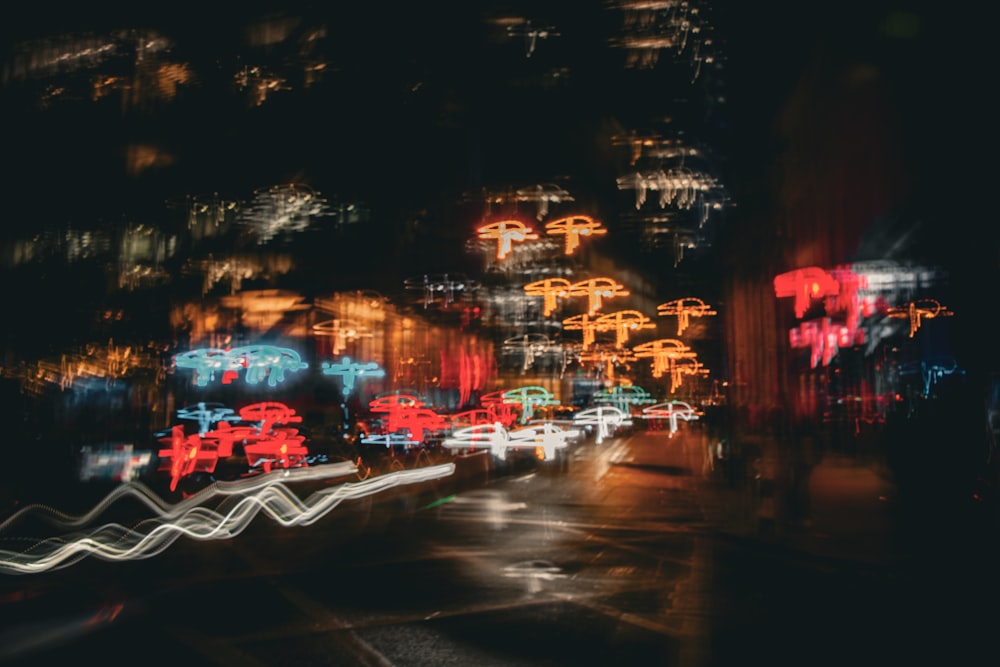 a blurry photo of a city street at night