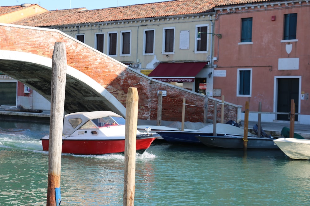 a boat is going under a bridge in the water