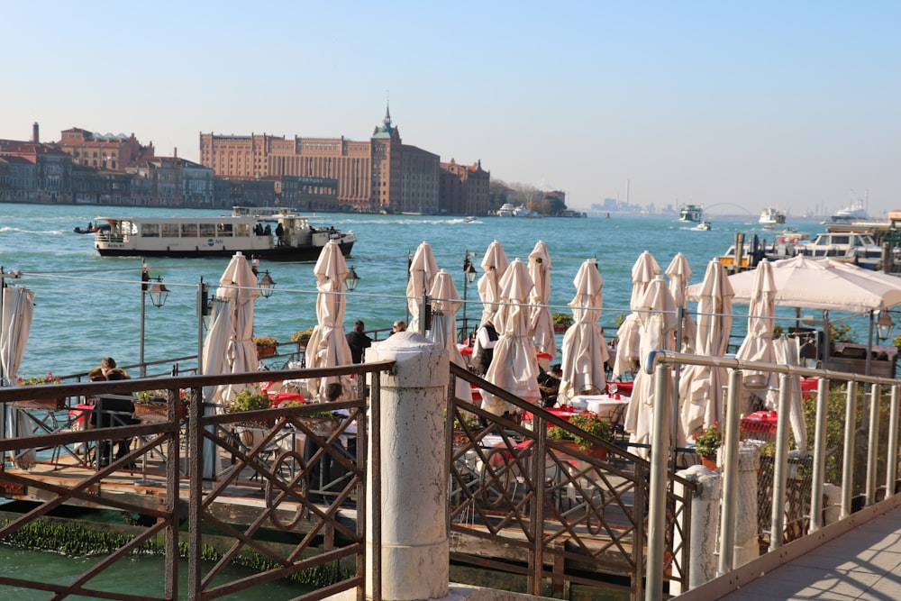 a bunch of umbrellas that are on a pier