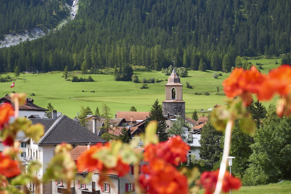 a view of a town with a steeple in the background