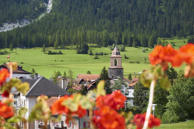 A Val Gardena village and its steeple, under the Dolomite walls