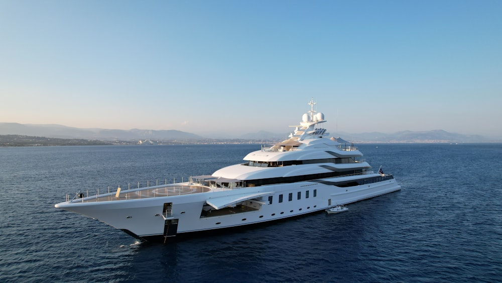 a large white boat in the middle of the ocean