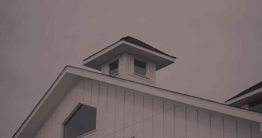 a white building with a clock tower on top of it