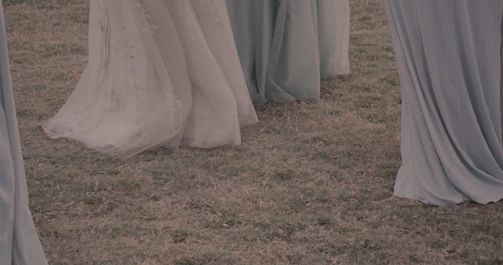 Earth-toned flowy dresses displayed in soft natural light.