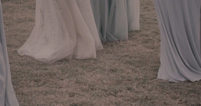 A flowing midi dress in soft pastel hues, captured in natural light to emphasize its graceful silhouette.