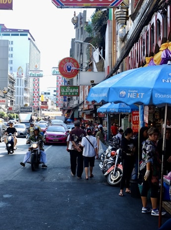 A vibrant street scene in Thailand showcasing chaotic traffic.