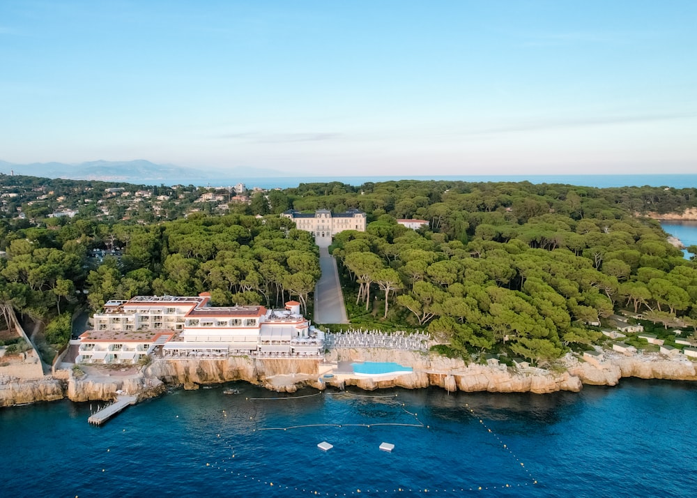 an aerial view of a resort surrounded by trees