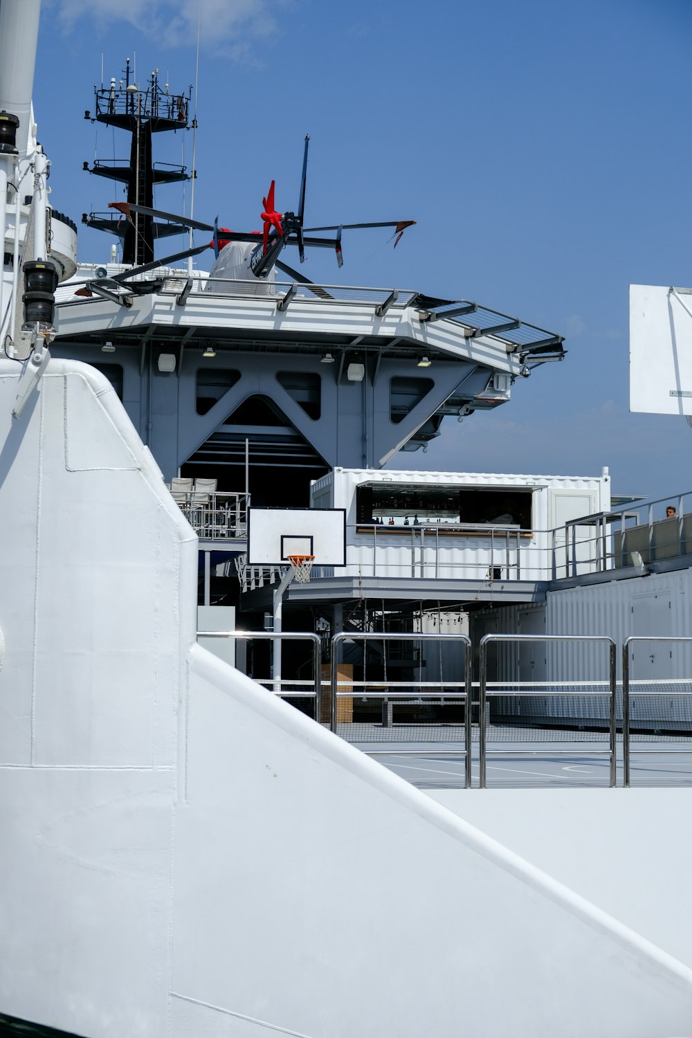 a large white ship with a helicopter on top of it