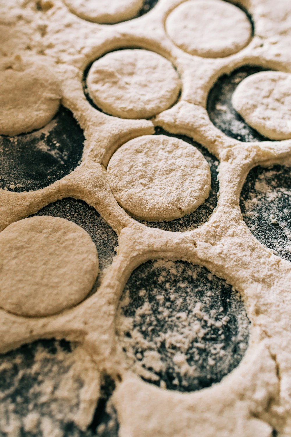 a close up of dough circles on a table