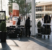 A licensed driver-guide assisting guests with their luggage.