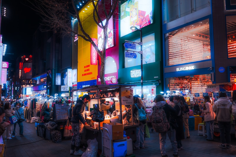 Crowd outside a shop in Seoul at night