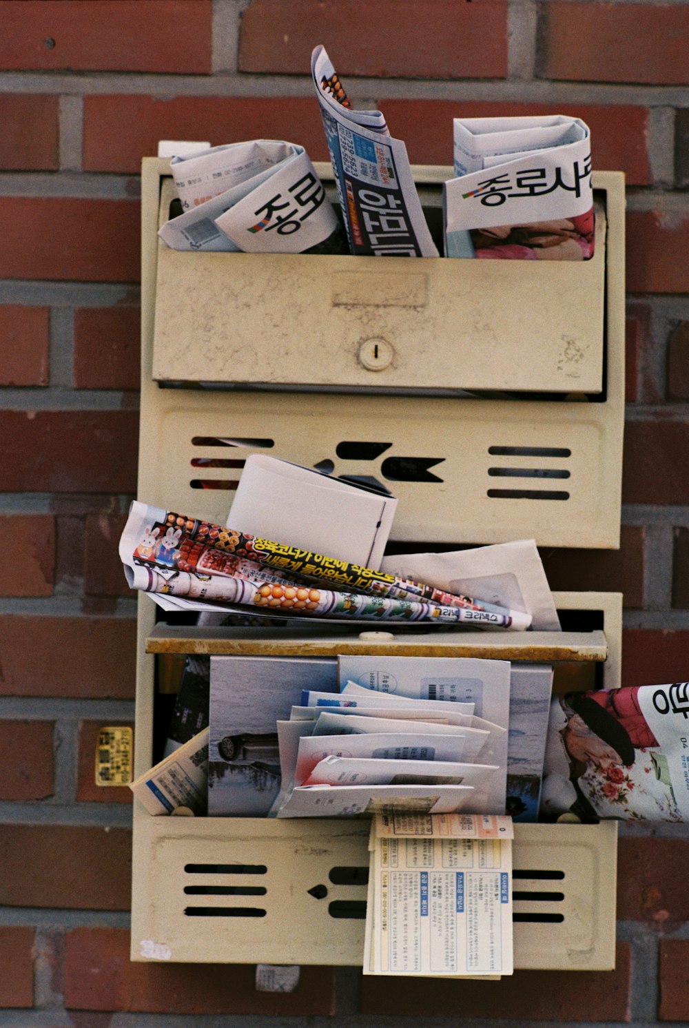 a mailbox that has a bunch of mail in it