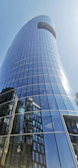 High-rise office tower in Riyadh with sleek glass facade under clear sky