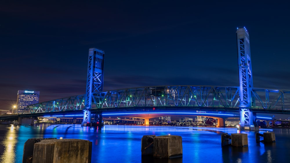 a large bridge over a body of water at night