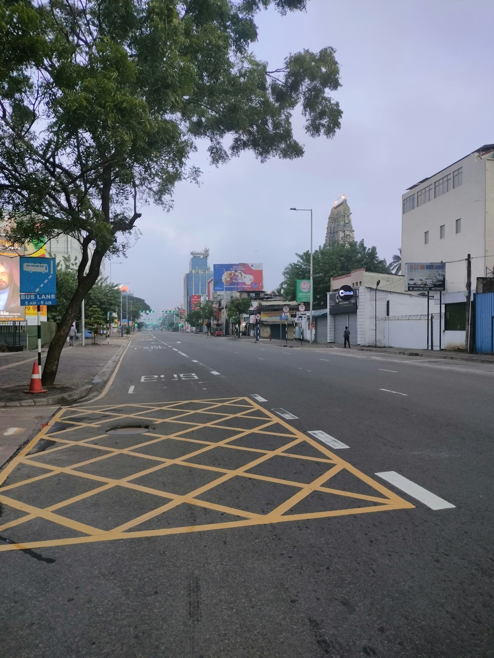 an empty street with a yellow line painted on it