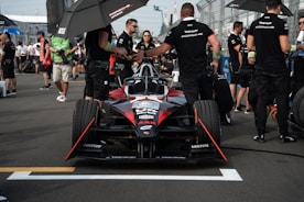 A team of racers strategizing before a race.