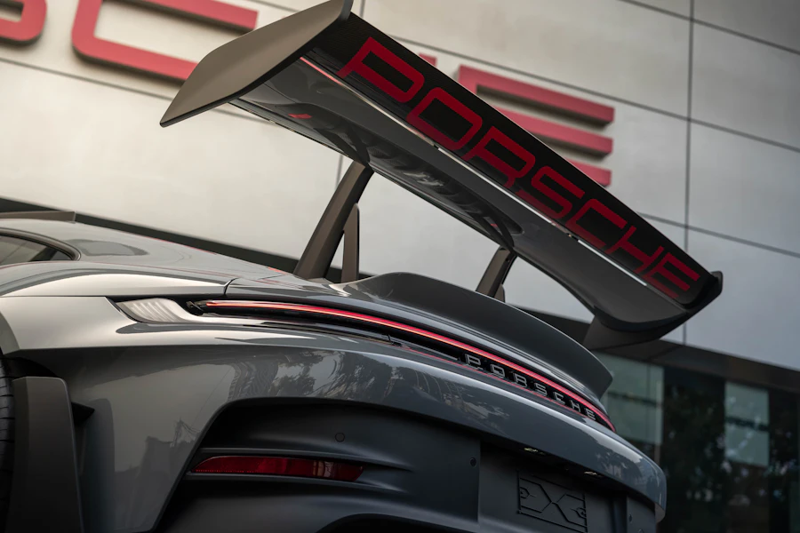 Close-up of a Porsche rear wing with Porsche lettering