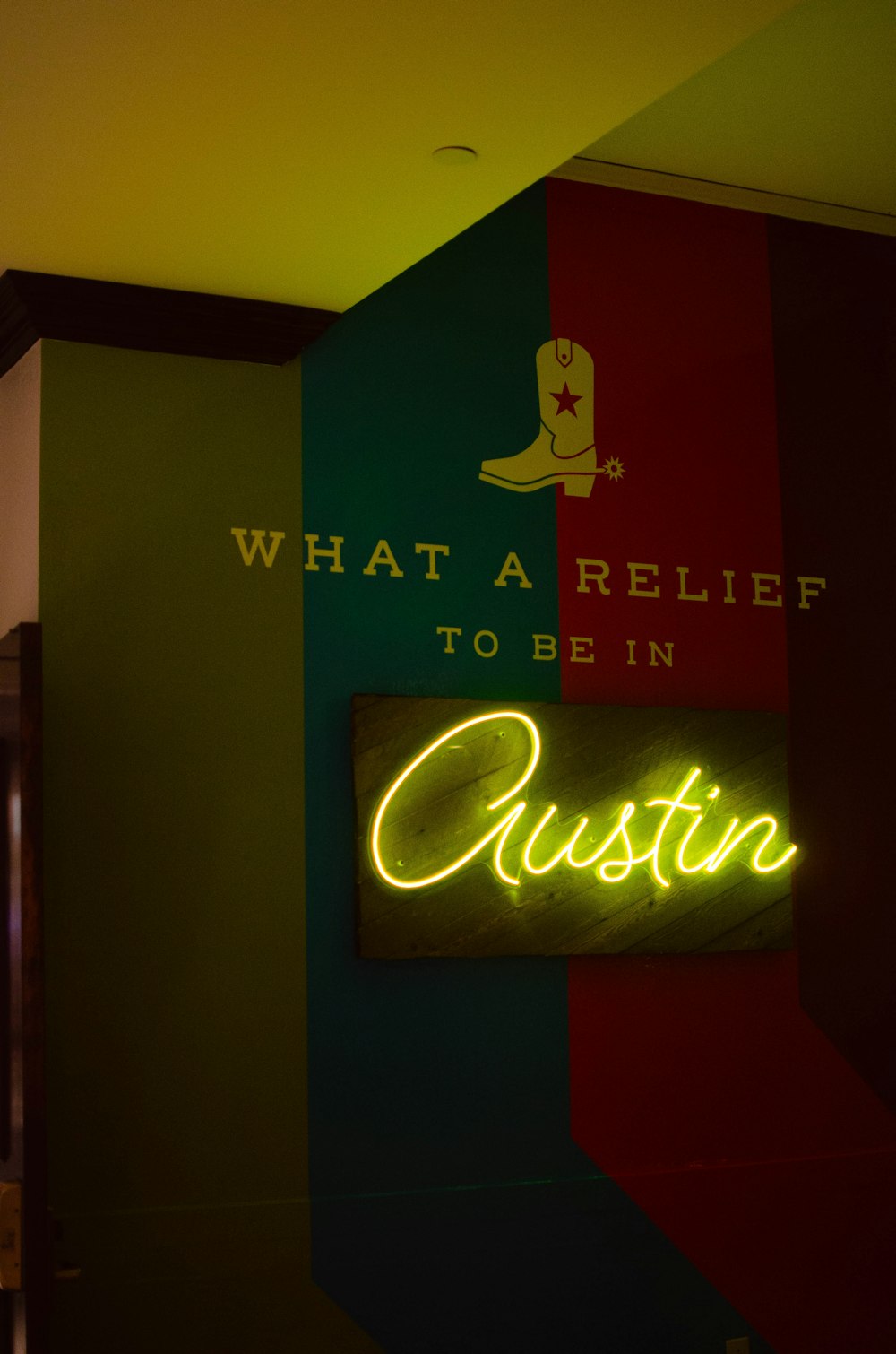 a neon sign that says what a relief to be in custom