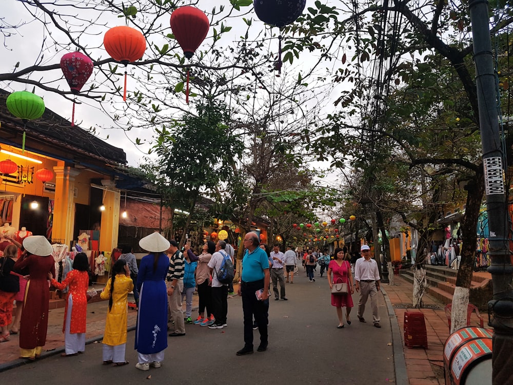 a group of people walking down a street