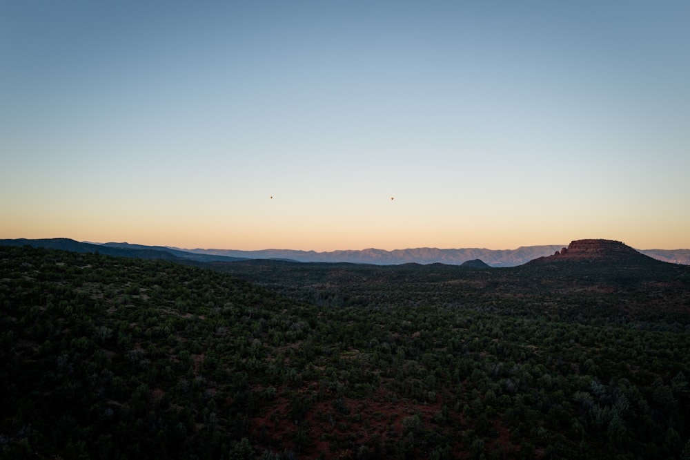 a view of a mountain range at sunset