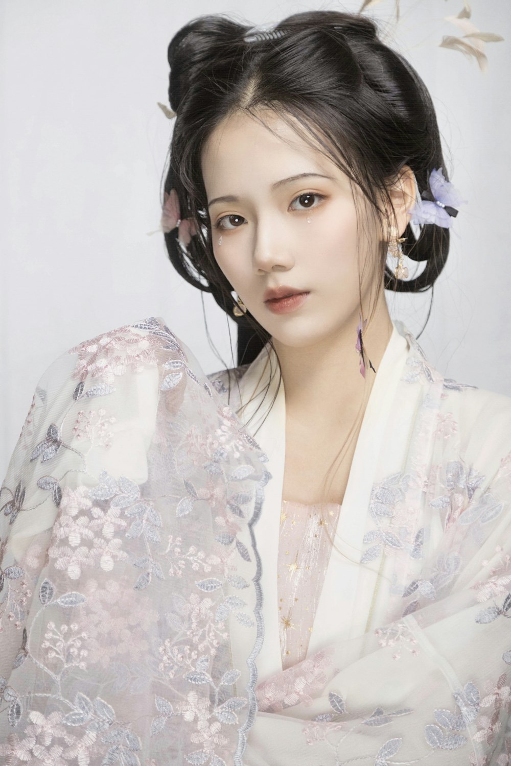 a woman in a kimono with a flower in her hair