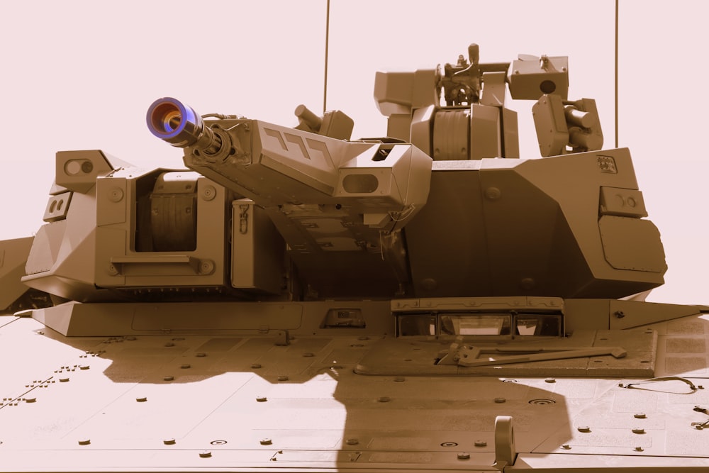 a close up of a military vehicle with a machine gun on top of it