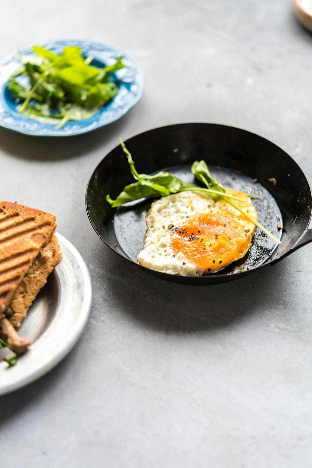 a plate of food on a table with a sandwich