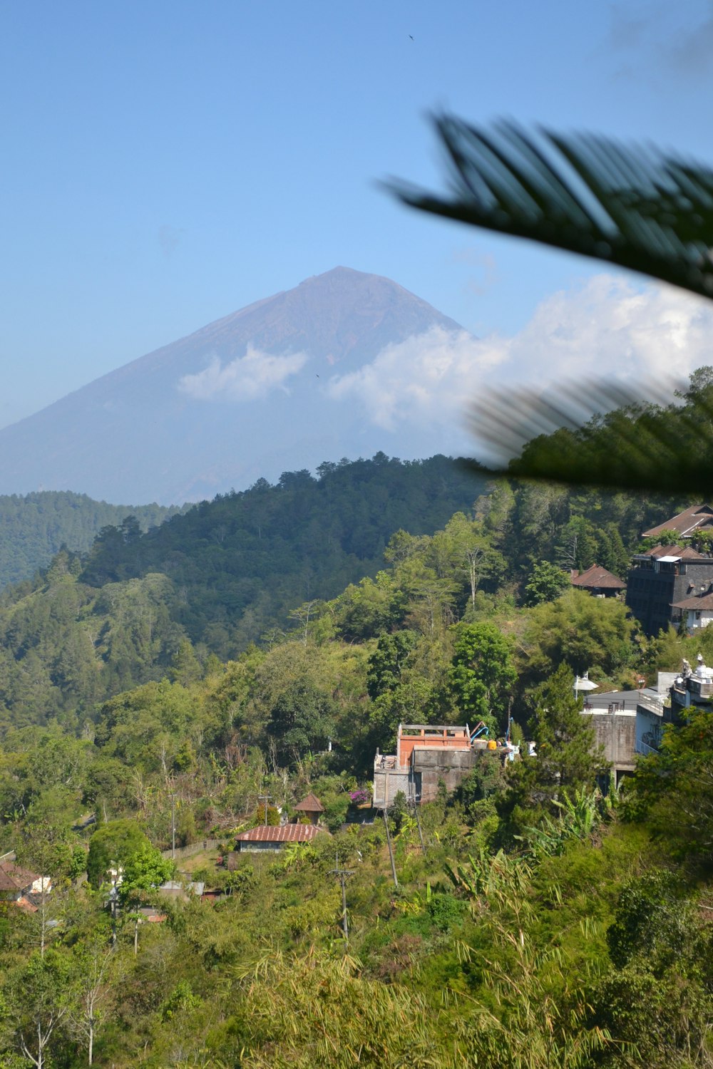 a view of a mountain with a house in the foreground