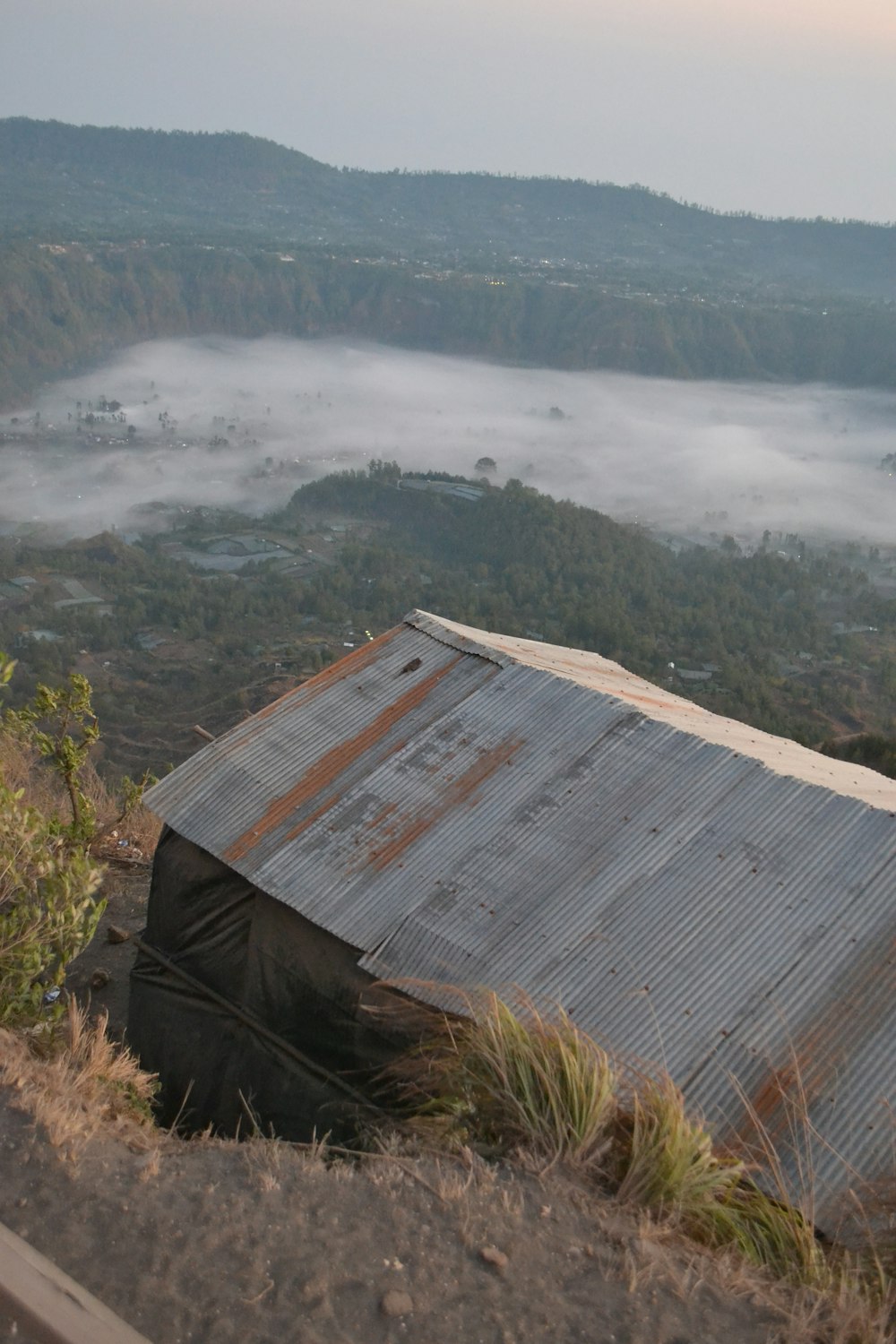 a metal structure sitting on top of a hill