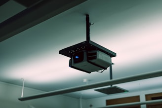 a security camera hanging from the ceiling of a building