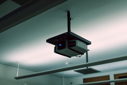 a security camera hanging from the ceiling of a building