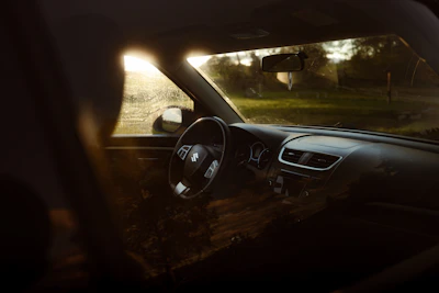 Close-up of a sparkling clean dashboard with reflections of sunlight.