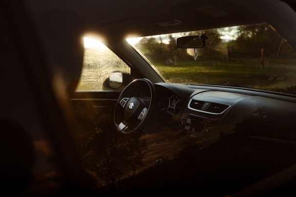 Close-up of a freshly cleaned car dashboard shining under natural light.