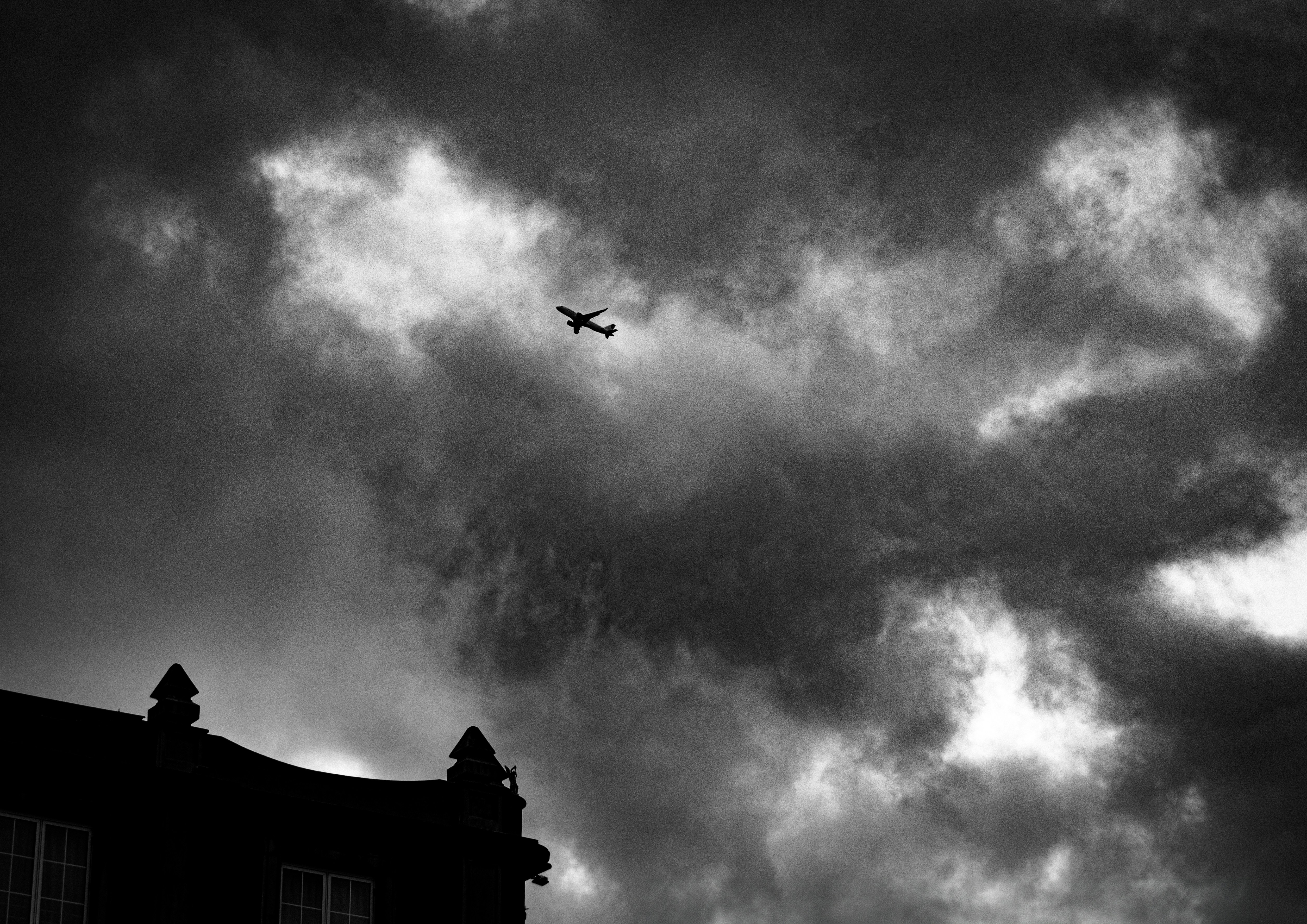 A black and white photo of a plane in the sky photo – Free Photo Image ...