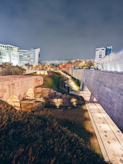 Nighttime scene of a heritage site illuminated with augmented reality visuals blending past and present