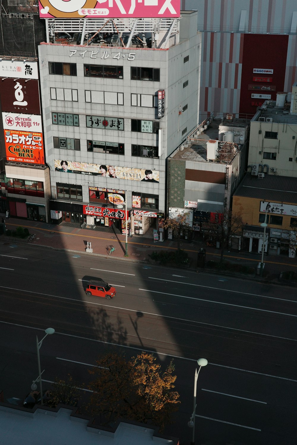 an aerial view of a city street with buildings