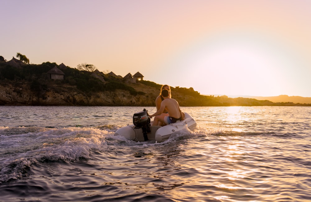 a woman riding a jet ski on top of a body of water
