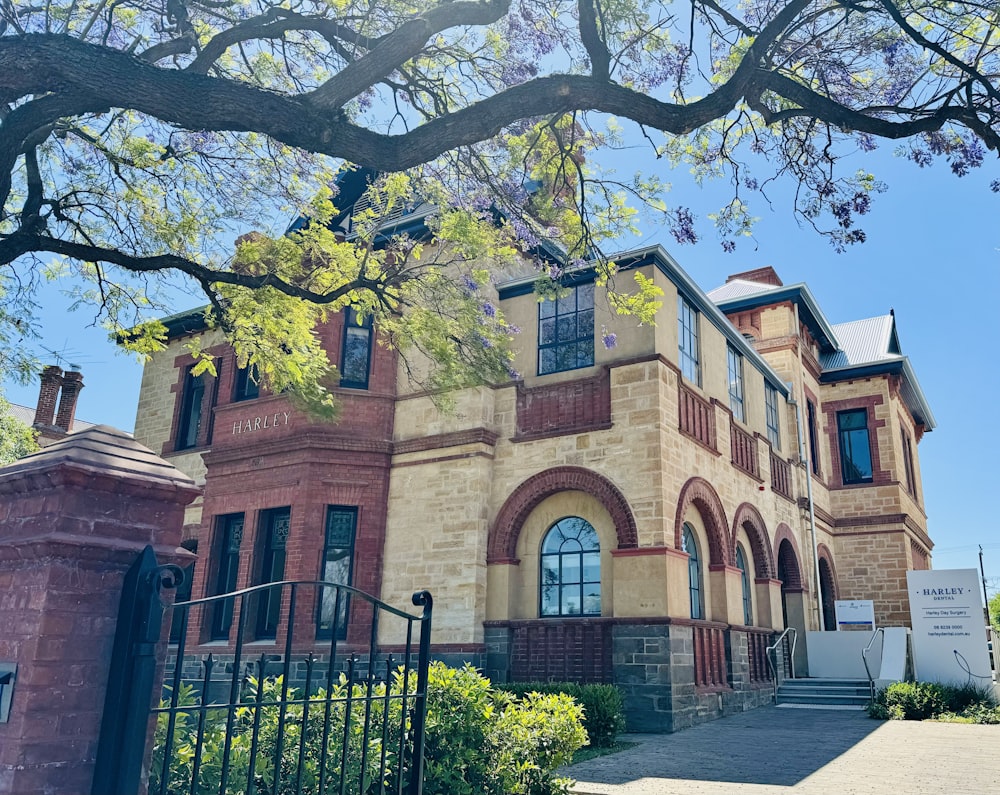 a large brick building with a gate in front of it