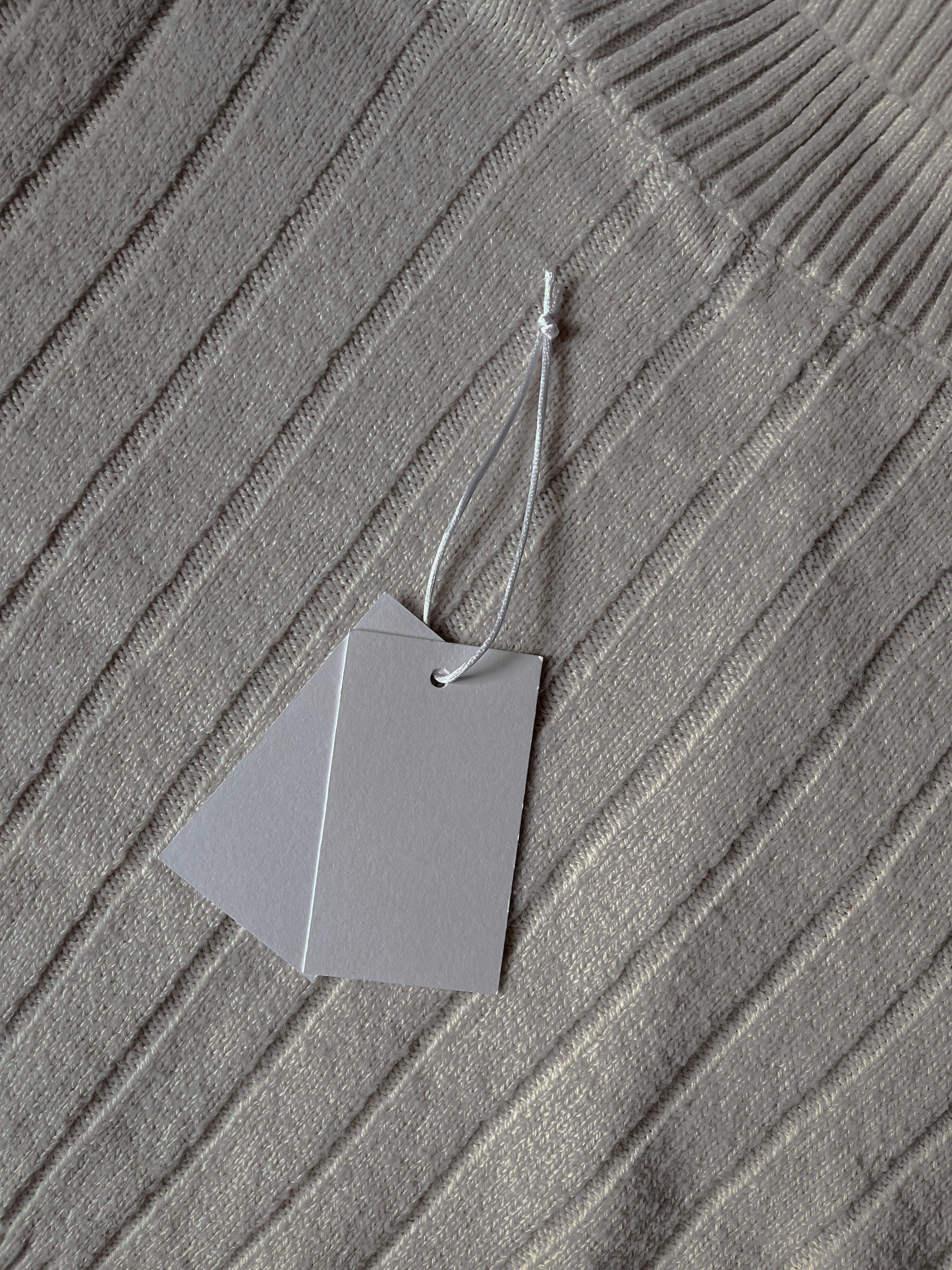 a piece of paper hanging from a string