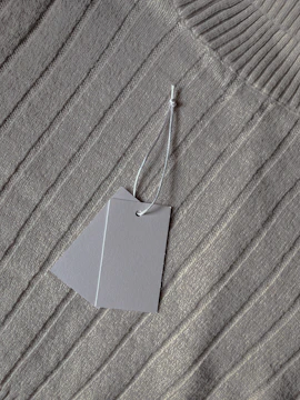 a piece of paper hanging from a string