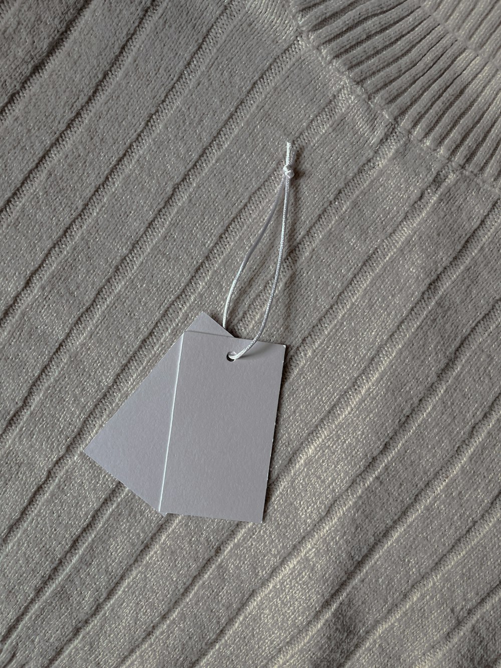 a piece of paper hanging from a string