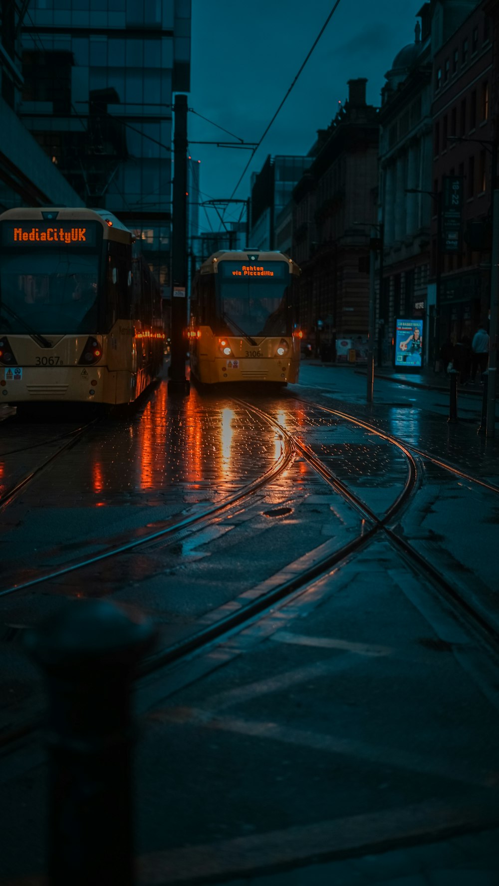 a couple of buses that are sitting in the street