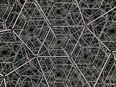 Close-up of metallic silver hexagons interlocking over a deep blue ocean background.