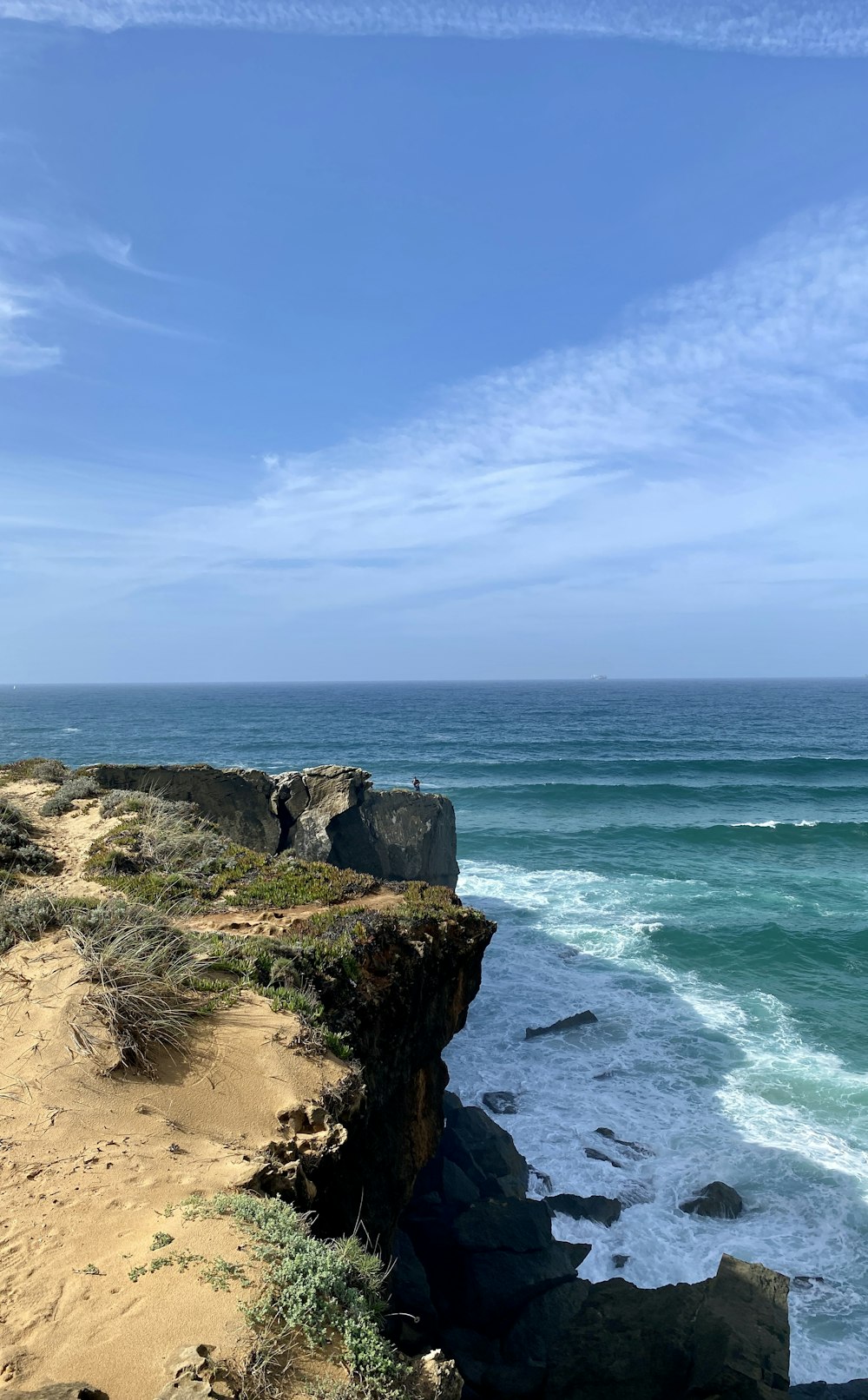 a view of the ocean from a cliff