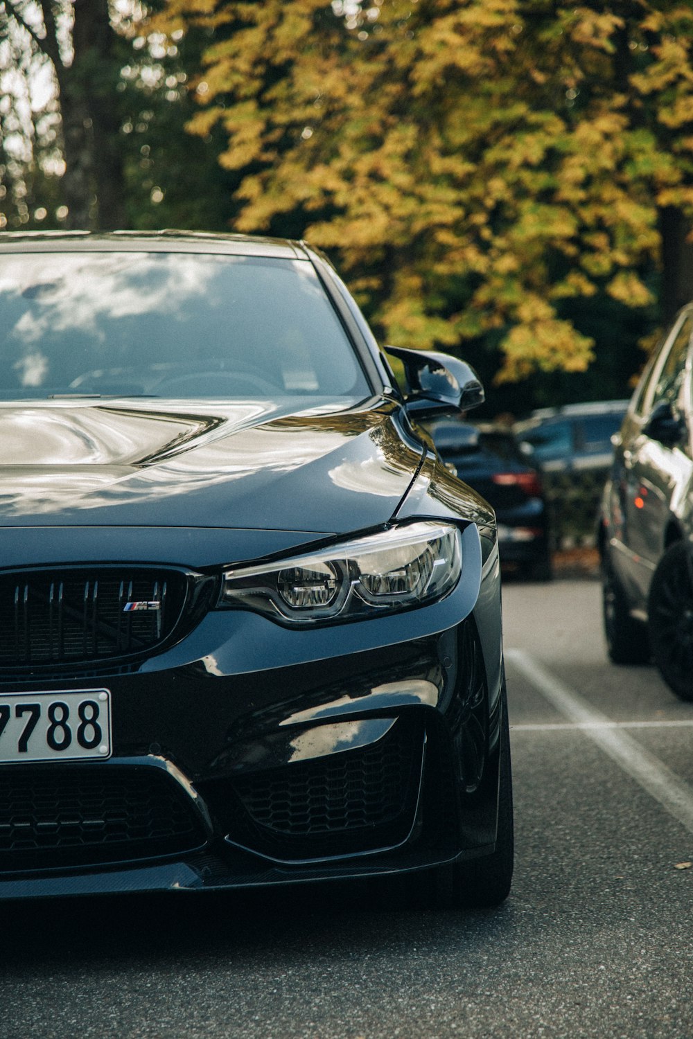 a black car parked on the side of the road