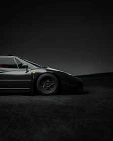 Sleek black delivery van with carbon fiber texture background and metallic silver accents.