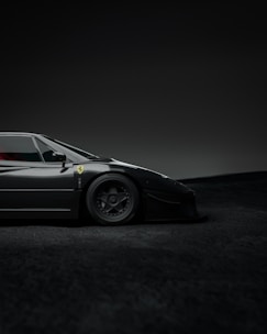 Yellow car with spinning wheels on dark gray background symbolizing xoom's ride service.