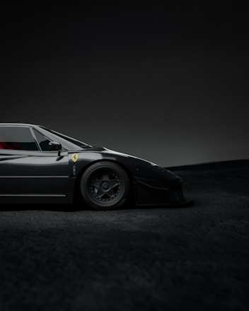 Dark mode image featuring sleek abstract curves of a luxury sports car.