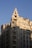 A tall, cream-colored Art Deco building with multiple stories and a decorative top rises against a clear blue sky. The architecture features vertical lines and ornate details, with many windows and a prominent sign reading 'UNION' near the top.