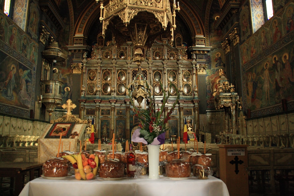 a table in a church with a bunch of food on it